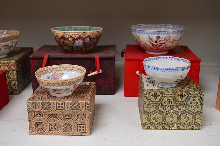 A collection of late 20th century Chinese boxed eggshell bowls, and four wood stands
